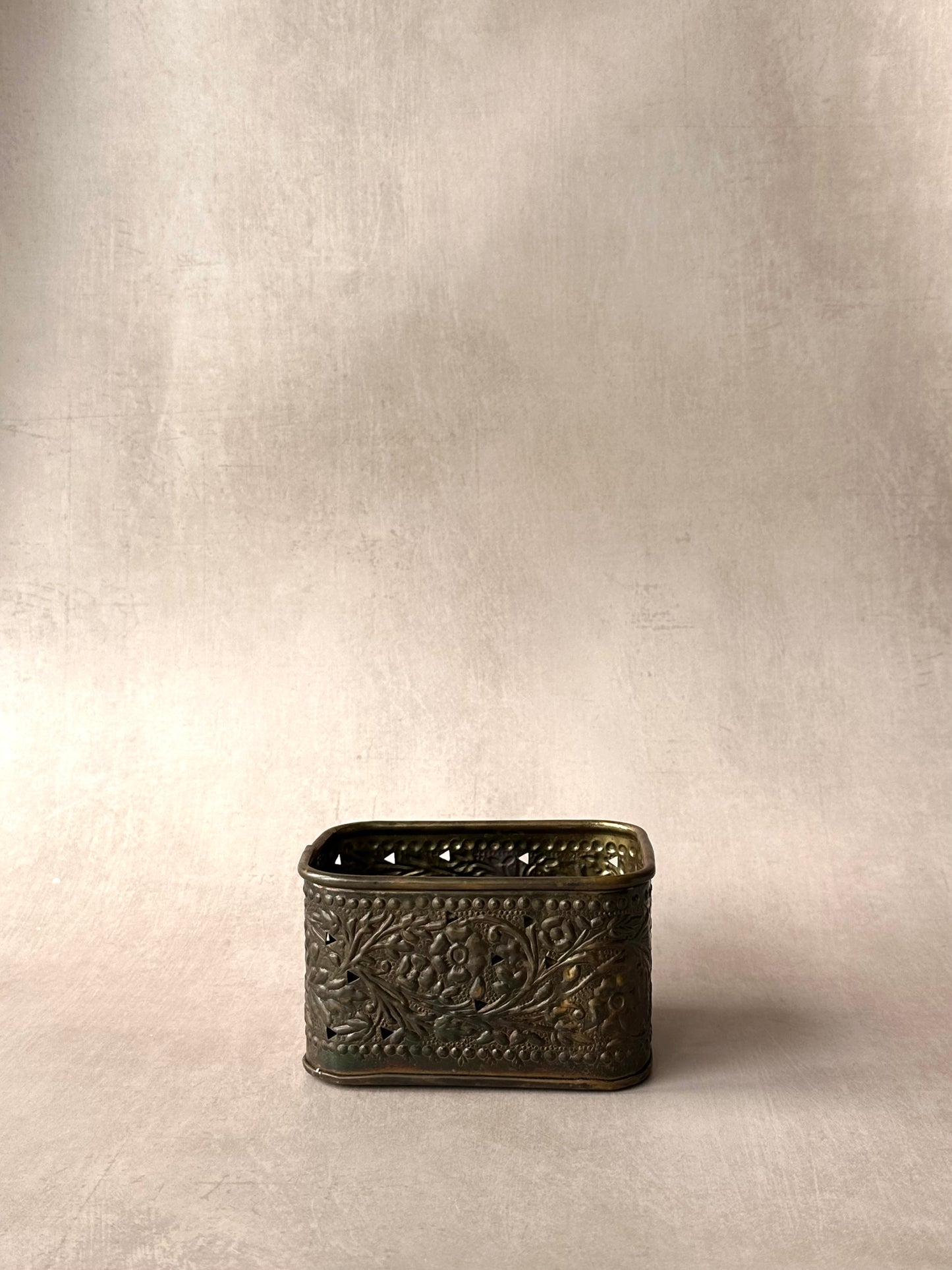 Square bronze embossed container