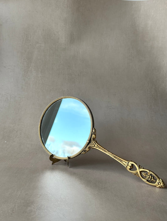 Miroir à main vintage en laiton